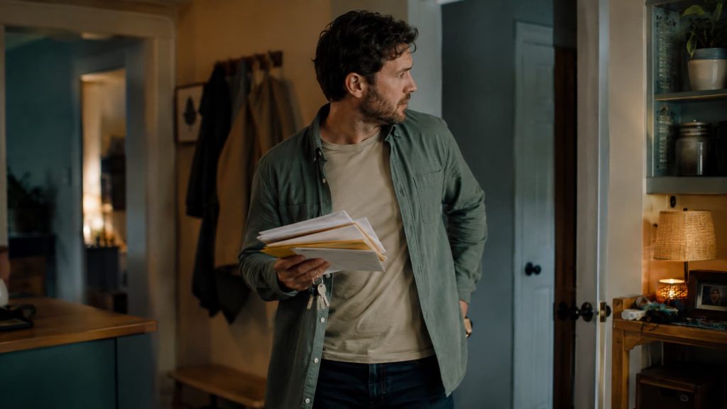 ADHD symptoms in adults shown by a man searching for misplaced items at home